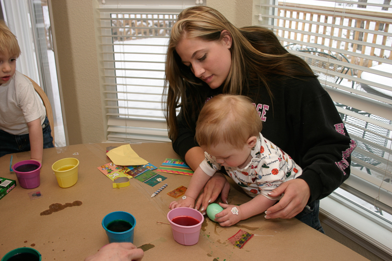 Ashley Gionfriddo and David Kish coloring Easter eggs.