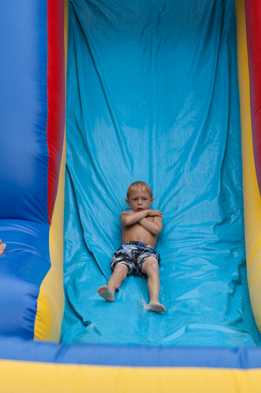 David Kish rides the water slide.